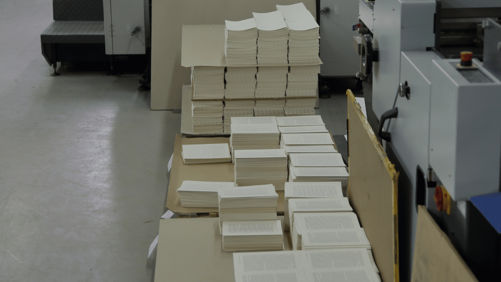 Stacks of printed interior book files prepared for book printing production
